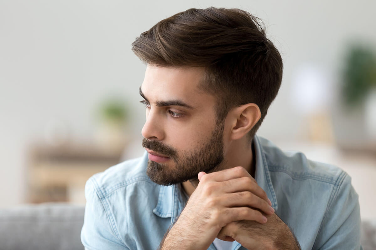 Man wondering "Am I an alcoholic" can overcome his alcohol addiction at an alcohol addiction treatment center.